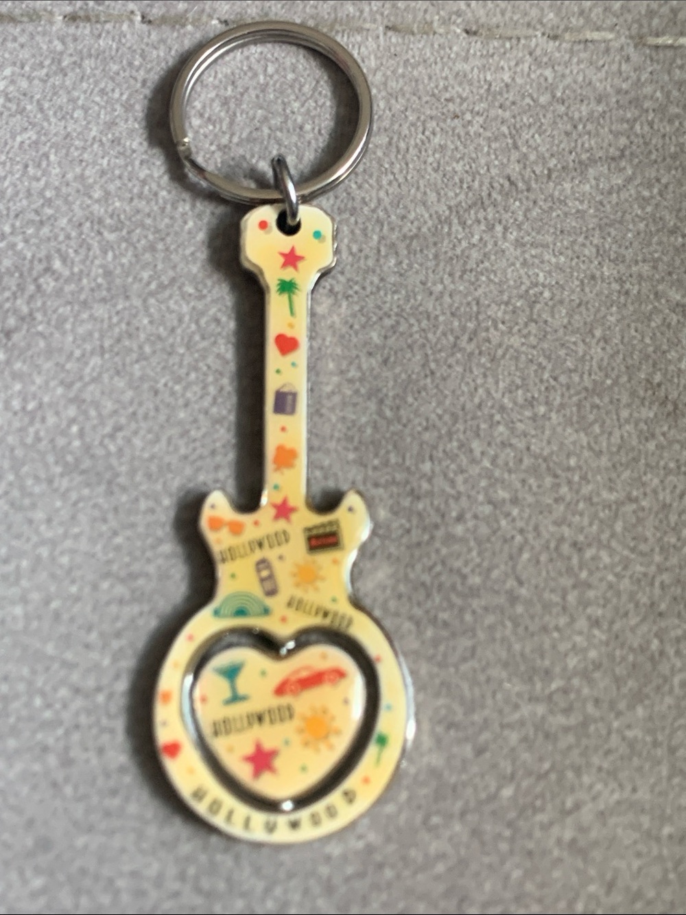 Guitar-Shaped Keychain with Heart Cutout - Yellow with Multicolor Icons